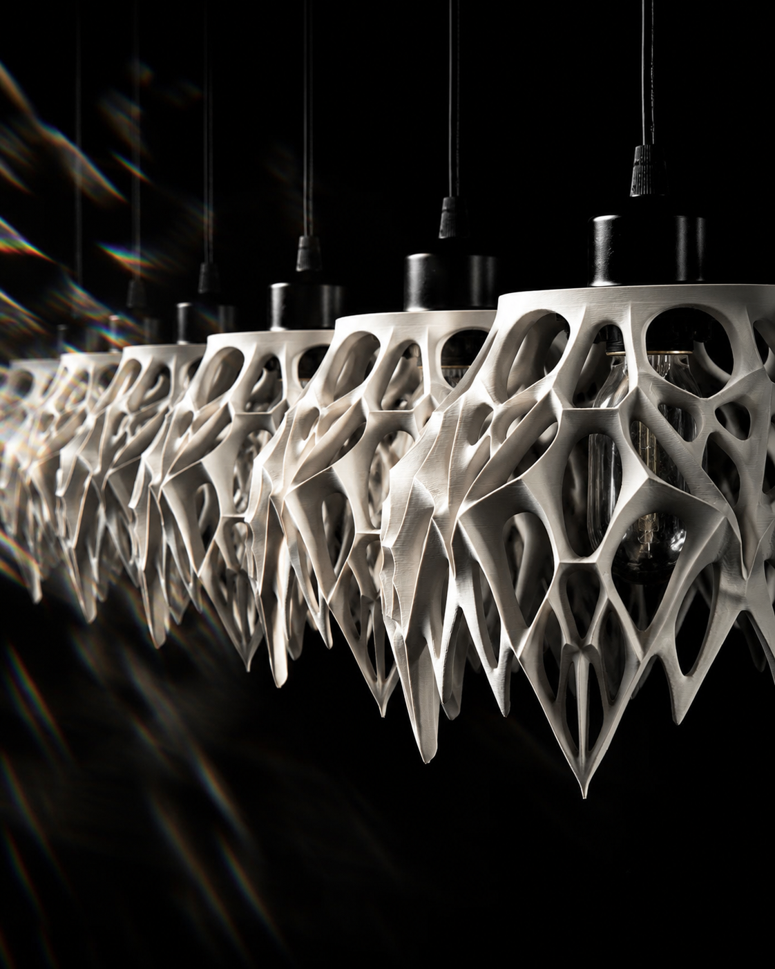 Group of Arachne pendant lamps arranged in a row